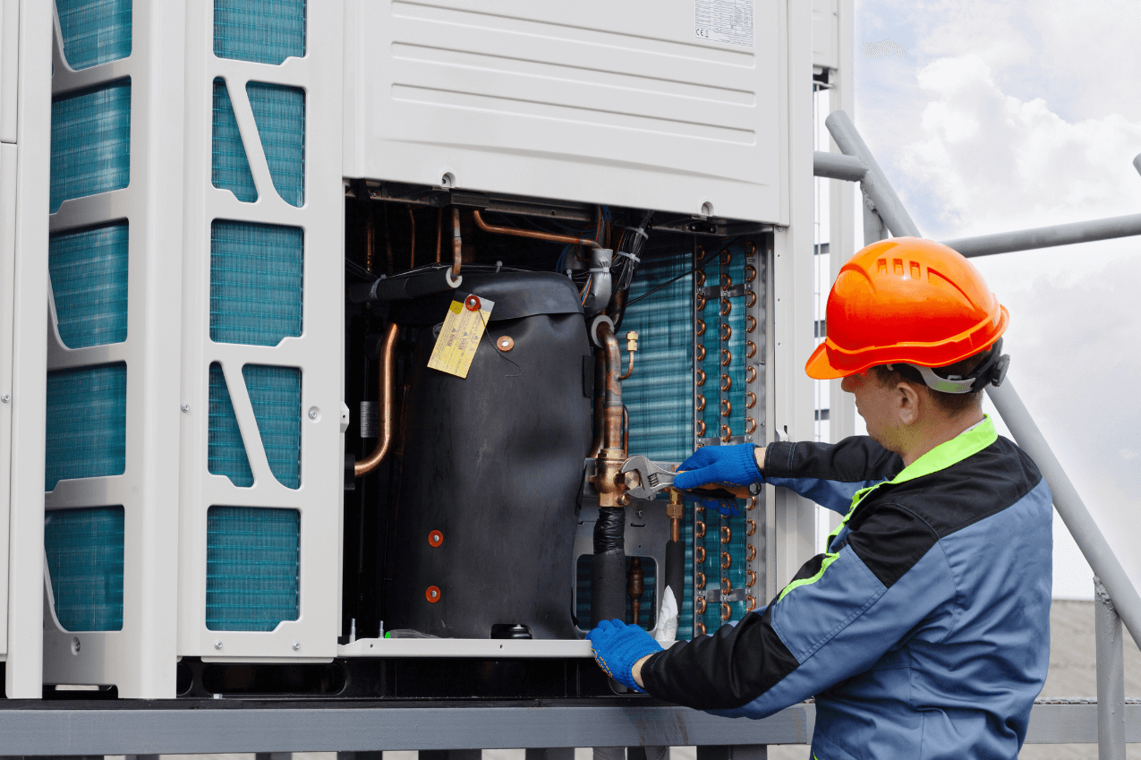 Commercial HVAC system repair being carried out by certified engineers inside large office building in Dubai UAE